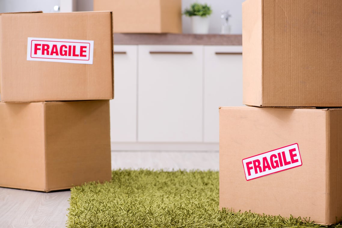 Man Moving House and Relocating with Fragile Items